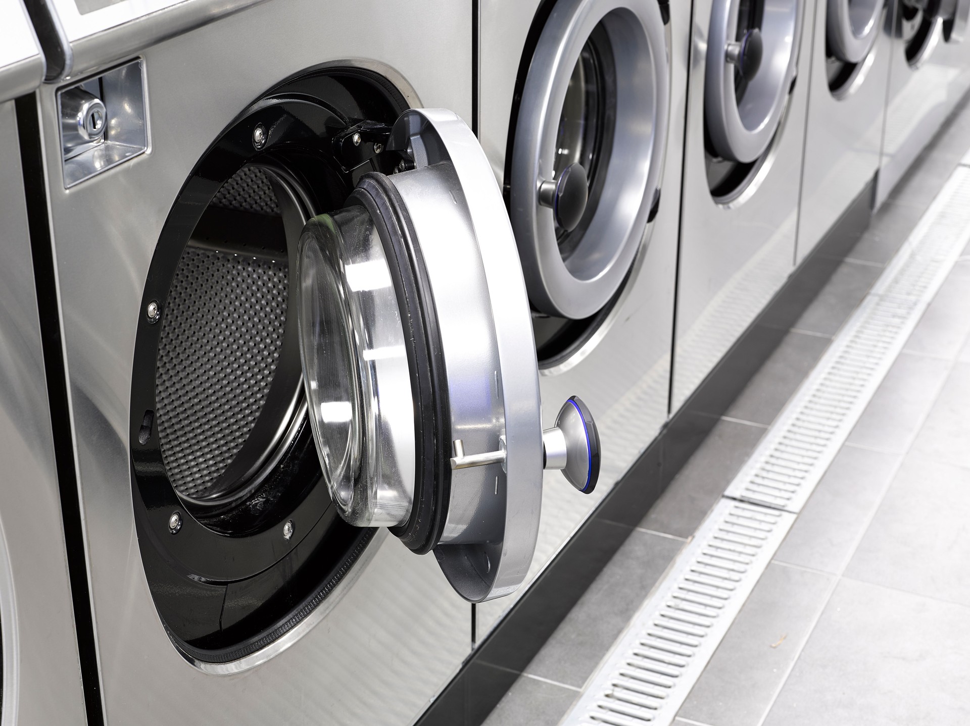 Industrial washing machines in a public laundromat